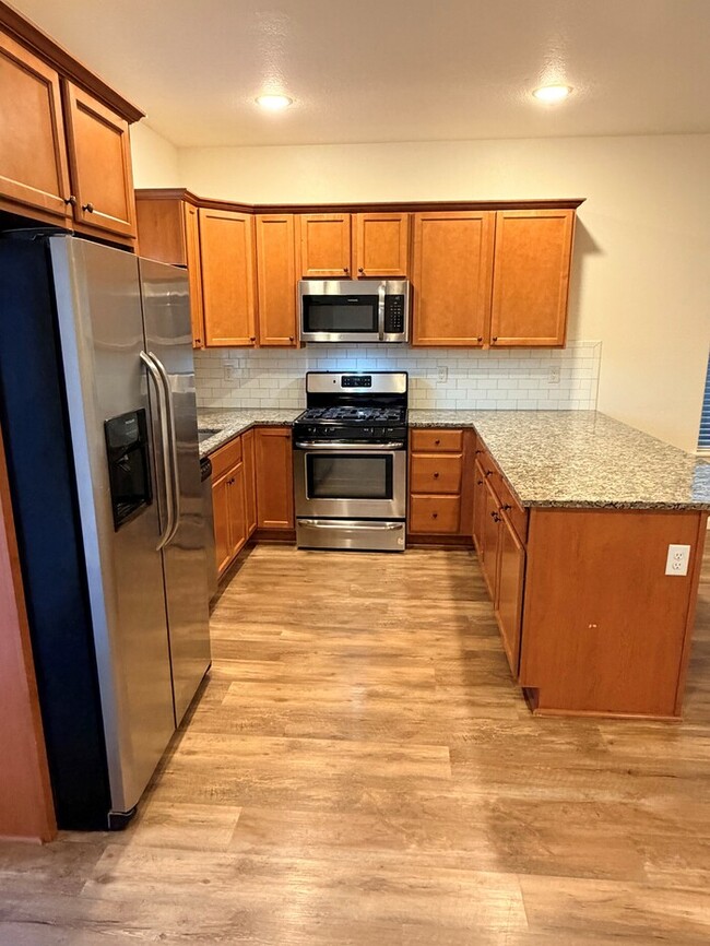 Photo - Beautiful Home w/Gas Fireplace, Plank Flooring, Fenced Yard, Garage, W/D & MORE!