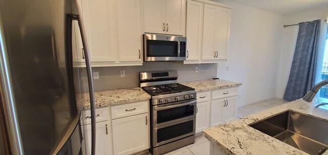 Photo - Beautiful townhome features a bright, open-concept layout