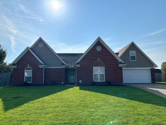 Building Photo - Spacious 4BR/2BA Olive Branch Home | 1,965 Sq Ft, Modern Fireplace, Bay Window & 2-Car Garage