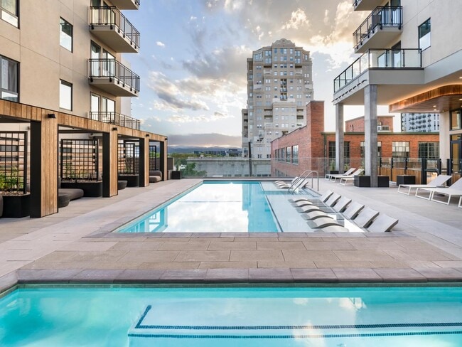 Escape the city buzz and dive into pure relaxation at Modera Golden Triangle's resort-style pool and as the day cools, melt away stress in the hot tub. - Modera Golden Triangle