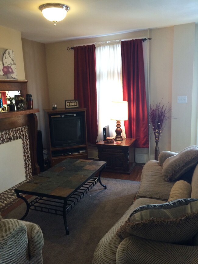 Living Room with Decorative Fireplace - 2363 S 18th St Casa