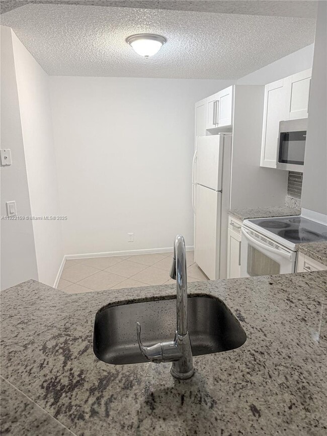 Photo - 8851 Wiles Rd Unit 204