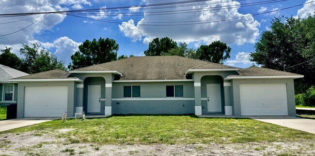 Photo - Charming 3BR/2BA Lehigh Acres Duplex with 1-Car Garage | Lawn Care & Salt Service Included