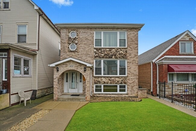 Building Photo - 6212 S Major Ave Unit 2