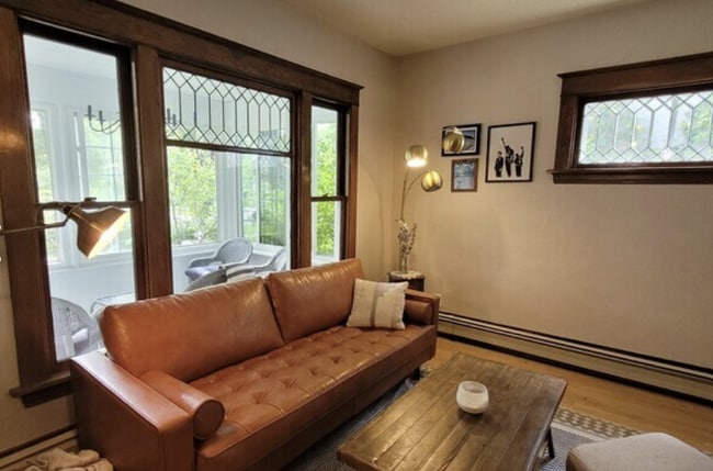 Living room with large window displaying the front porch - 1121 6th St S