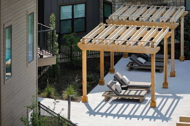 LOUNGE SEATING UNDER SHADDED PERGOLA