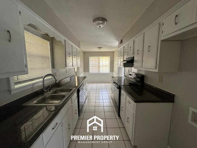 Photo - Gorgeous 4BR/2BA Bartlett Home with Brick Fireplace & Spacious Fenced Yard!