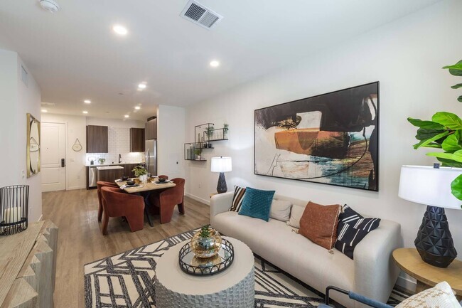 Relax and entertain in a generously sized living room, offering ample space for comfort and style. - Windsor Rancho PQ Rental