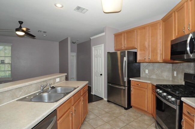 Photo - All appliances included! Gated lock and leave condo community in North Austin
