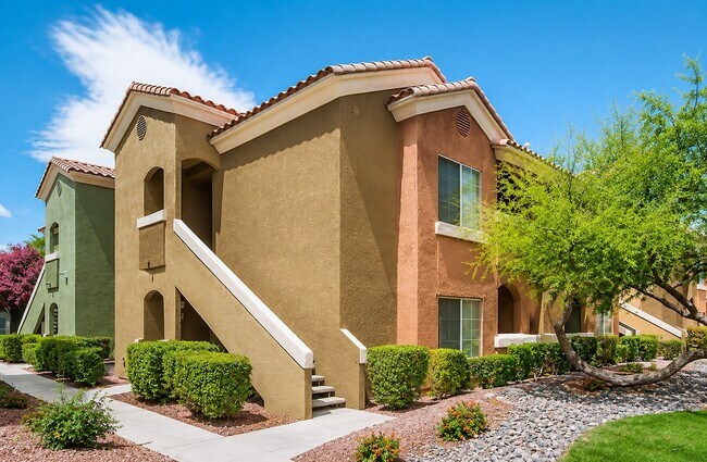 Spanish Ridge showcases modern architecture and inviting outdoor spaces framed by lush landscaping. Each unit is designed for comfort and style, reflecting a vibrant community atmosphere. Explore your future home today!