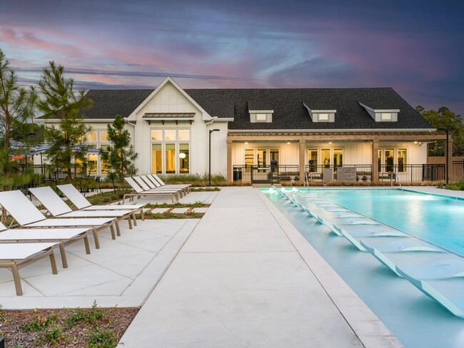 Resort-style pool with spacious sundeck at Beckett West Fork apartment homes in Conroe, TX. - Beckett West Fork Apartments