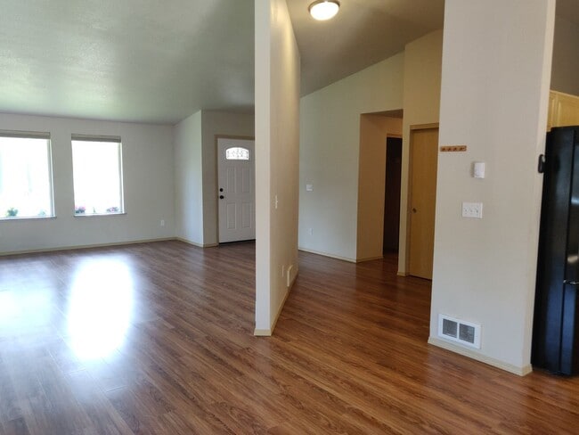 Photo - Charming 4-Bedroom Home on 1/2 Acre with a Fenced Backyard, Fully Insulated Double-Car Garage, in...