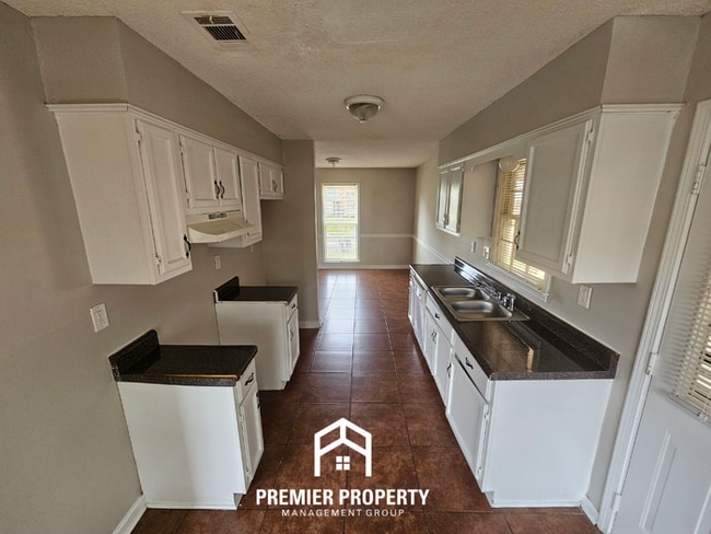 Photo - Quiet Cove Living in 38115 | 3BR/2BA with Brick Fireplace & Fenced Yard