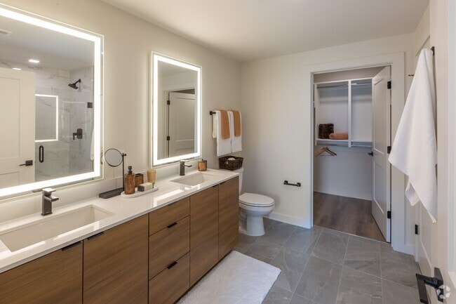 Backlit Vanity Mirror in All Bathrooms | A6 Wood Scheme | 1 Bedroom | 873 Sq. Ft. - Loria Ansley Rental