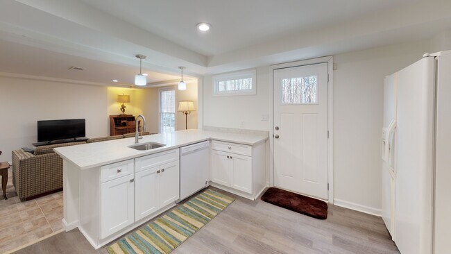 View of kitchen, overlooking living room