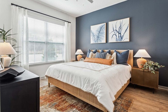 Experience tranquility in this beautifully designed bedroom, perfect for restful nights. - RISE Baymeadows
