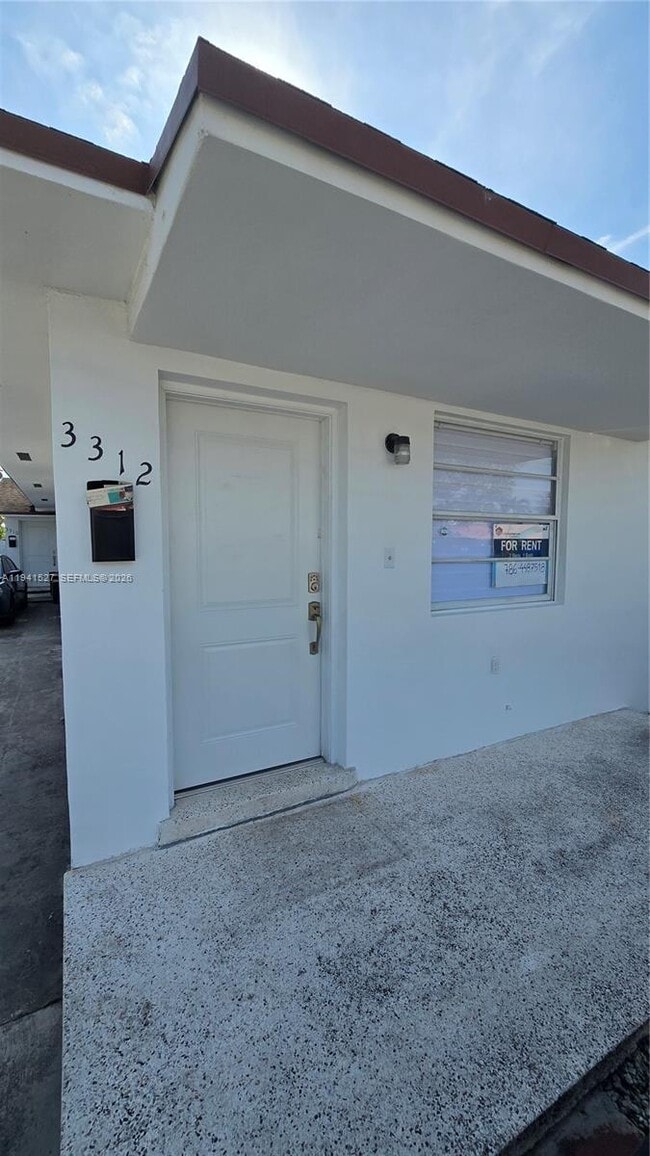 Building Photo - 3312 SW 24th Ter Unit .