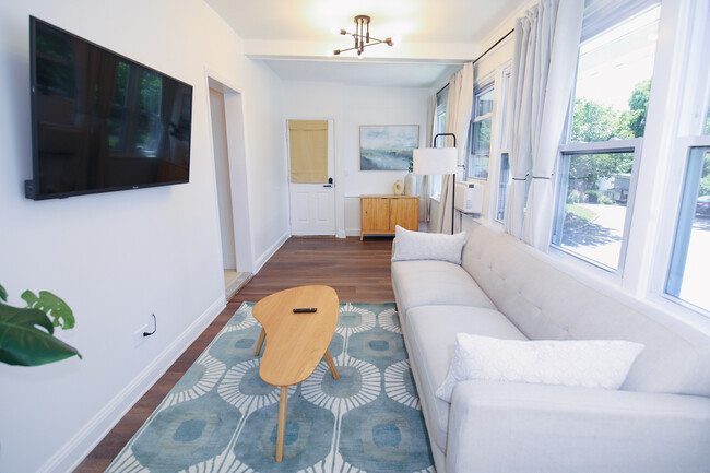 Gorgeous living room with natural light - 18 Everett Ave Apartments