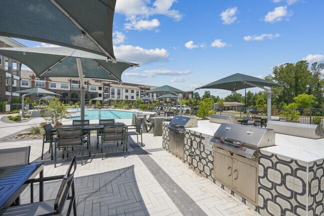 Outdoor Kitchen - Grill, dine and entertain outdoors with a convenient resident cooking and gathering space.