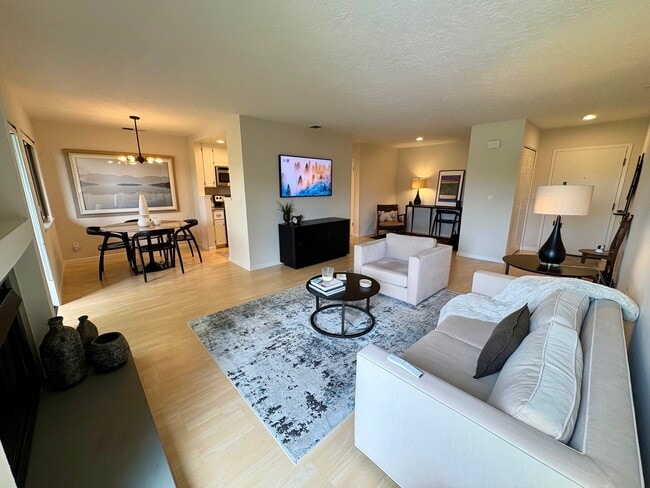 Living, dining and workspace areas - 820 Sea Spray Ln Unit 316