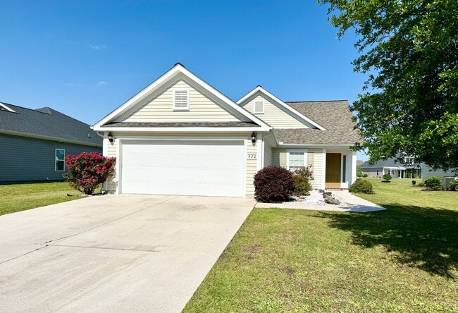 Building Photo - Like New 3 Bedroom & 2 Bath pond front home in Hillsborough! Enjoy the Community Pool, Playground...