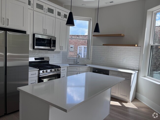Building Photo - 1408 W Cuyler Ave Unit 1 Rental
