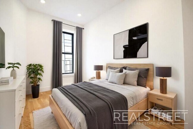 Photo - Modern & Bright 2BR with Rooftop Deck, Central A/C & Dishwasher | Bed-Stuy/Bushwick Border Unit 4B