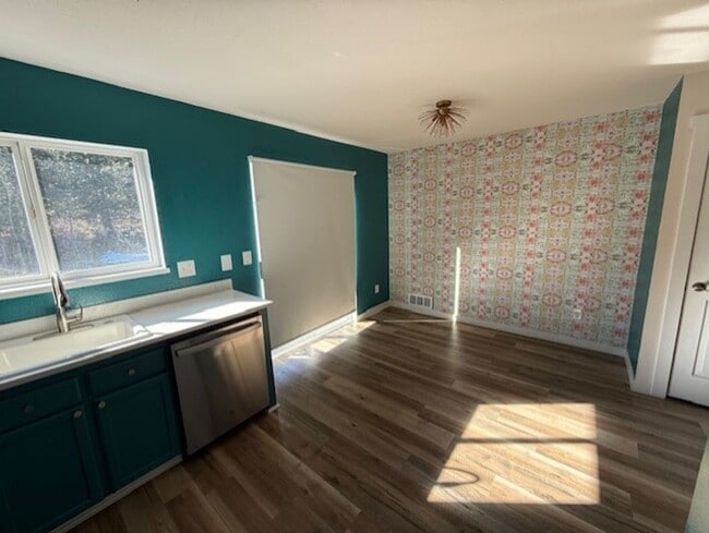 Photo - Updated duplex on quiet street. Large yard, all appliances.