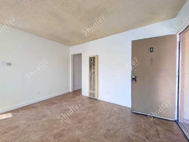 Upstairs 2 Bedroom 1 Bath with Massive Walk In Closet, Covered Gated Parking