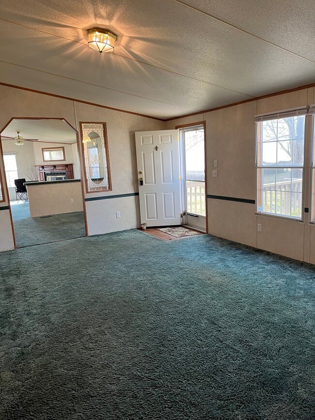 Living room open to dining and den - 2301 Wildcat Creek Rd