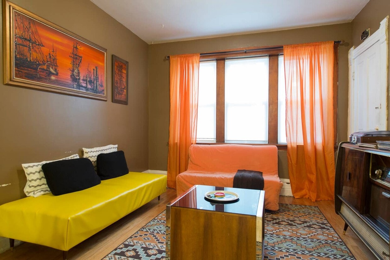 Staged pre-renovation photo of living room - 2640 West Thomas Street (Chicago, IL)