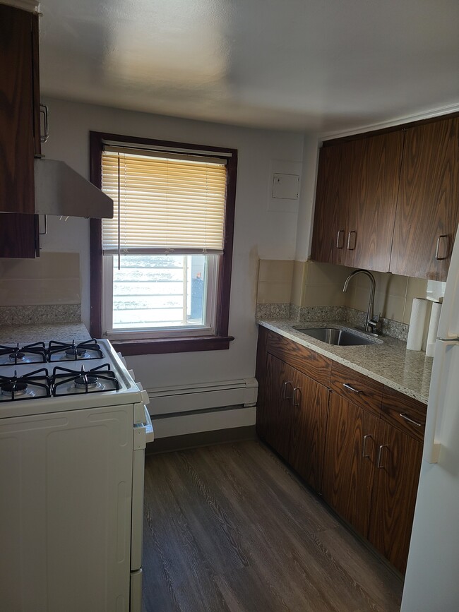 Kitchen with new marble tops, window and fan - 131 Depeyster St Unit 2nd Floor