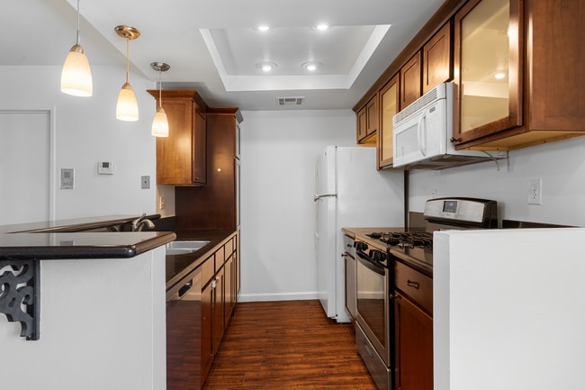 kitchen with breakfast bar - 11100 Acama St Unit 13