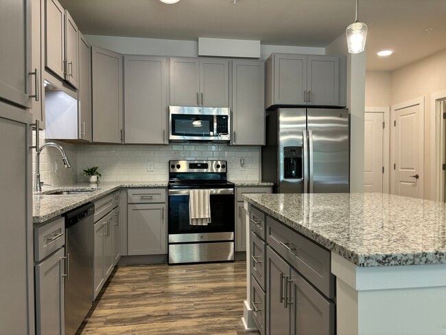 Lowell Island and Kitchen Cabinet - Fox Crossing Luxury Apartments
