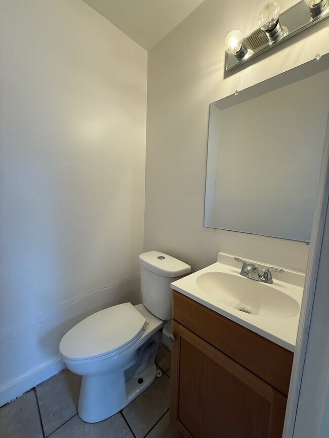 Photo - Charming 3BR/1.5BA Home with Large Yard & Spacious Eat-In Kitchen