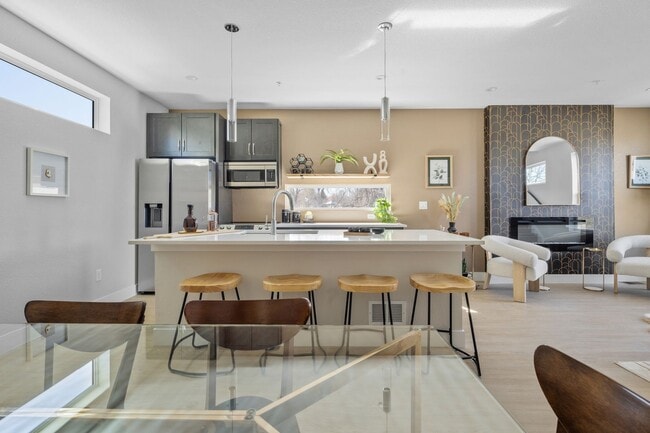 Building Photo - MOVE IN INCENTIVES!! Bright & Spacious End-Unit Townhome with Garage, private yard area, and Pet...