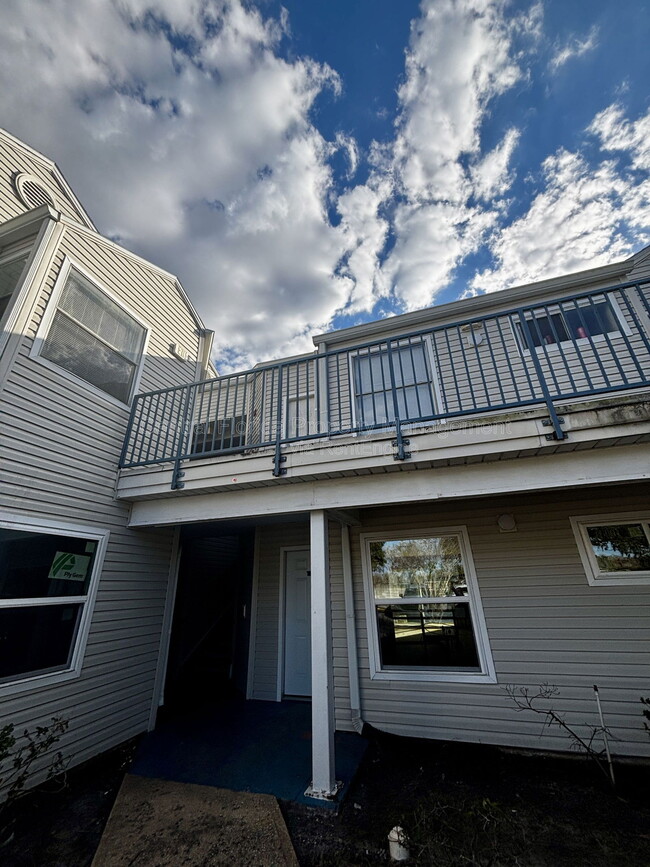 Building Photo - 2504 Woodgate Blvd Unit 202-1