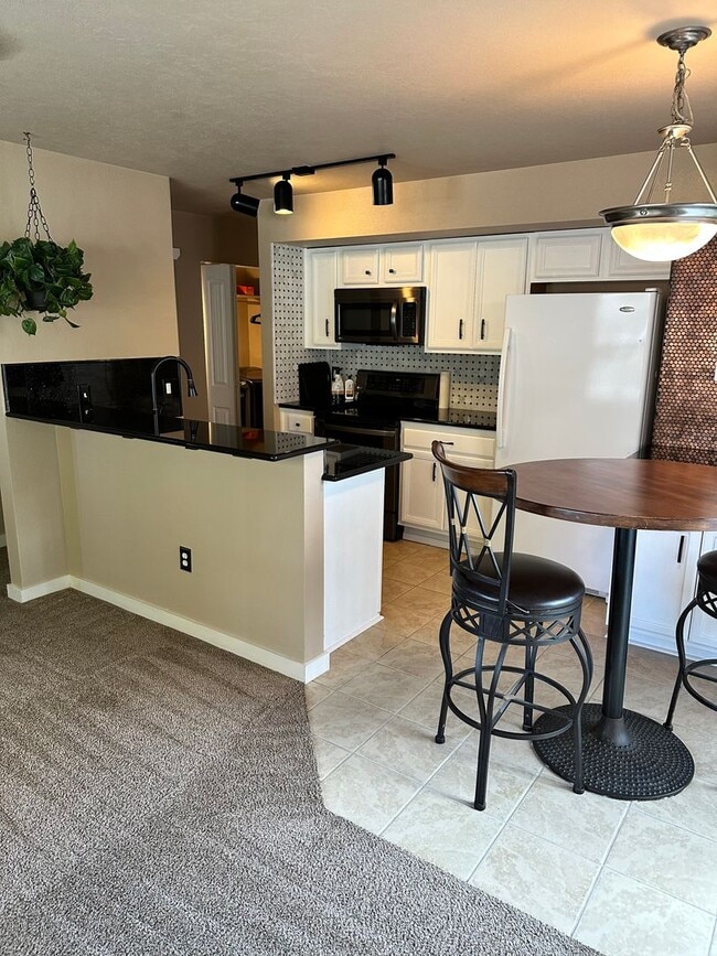 Photo - 3 Bedroom 2 Bath Townhome with Gas Fireplace, community pool, lots of storage