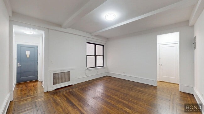 Building Photo - 140 W 55th St Unit 5A Rental