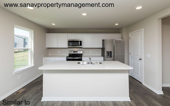 Photo - Beautiful 4BR/2.5BA Home Featuring Open-Concept Living & Modern Upgrades