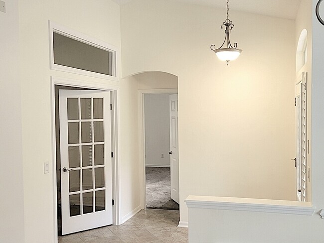Office Den entrance (left) & Primary Suite Entrance (center) - 4538 Palmetto Cove Ln