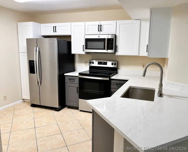 Photo - 8701 Wiles Rd Unit 204