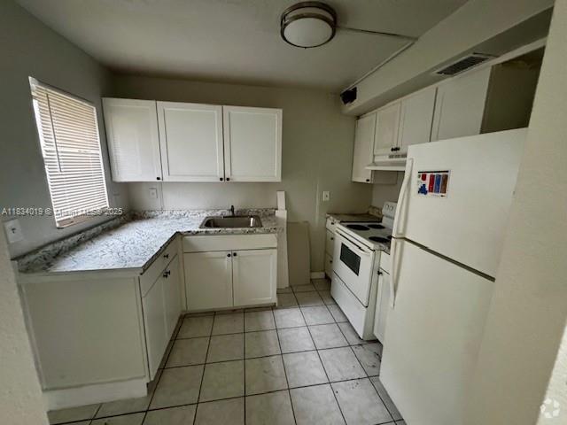 Building Photo - 5208 NW 18th Ct Unit 1K Rental