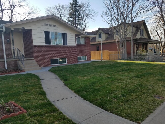 Building Photo - ***AVAILABLE NOW***

Spacious 4-Bedroom Wheat Ridge Home with Finished Garden Level and Two-Car G...