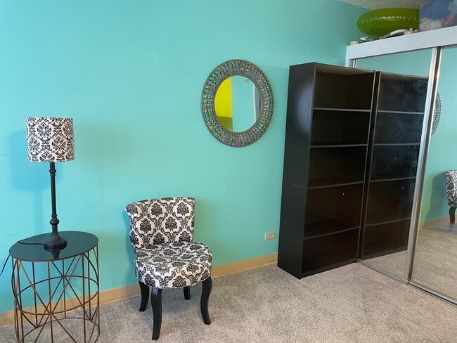 Mirror, chair, bookcase - 1550 Rycroft St Unit #514