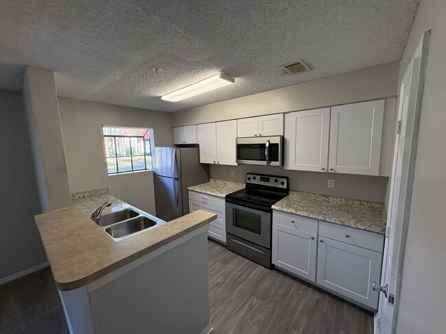 Photo - 1st floor unit with fire place and large patio