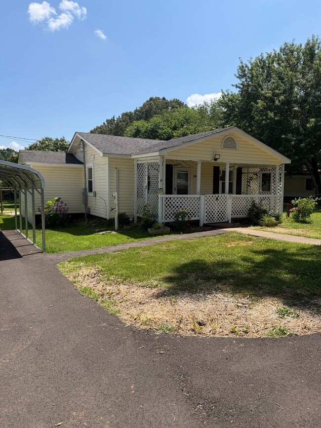 Photo - Charming 2-Bedroom Home with an Enclosed Sunroom & Peaceful Outdoor Living