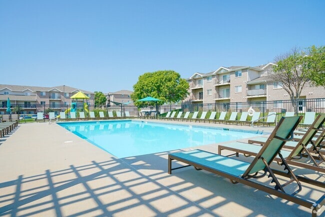 Take a dip in our pool or catch some rays on our pool deck. - Highland View Apartments