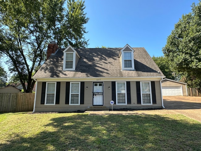 Building Photo - Charming 3BR/2BA Near Southwind | Hardwood Floors, Brick Fireplace, Bay Window & 2-Car Garage
