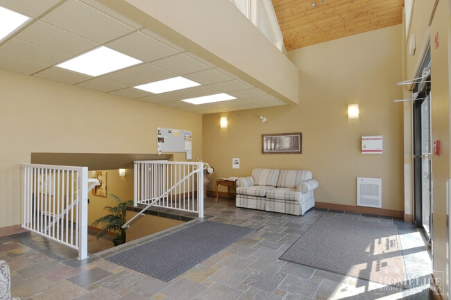 High-End Top-Floor 1 Bed + Den Condo with New Flooring & Paint in Central Chilliwack